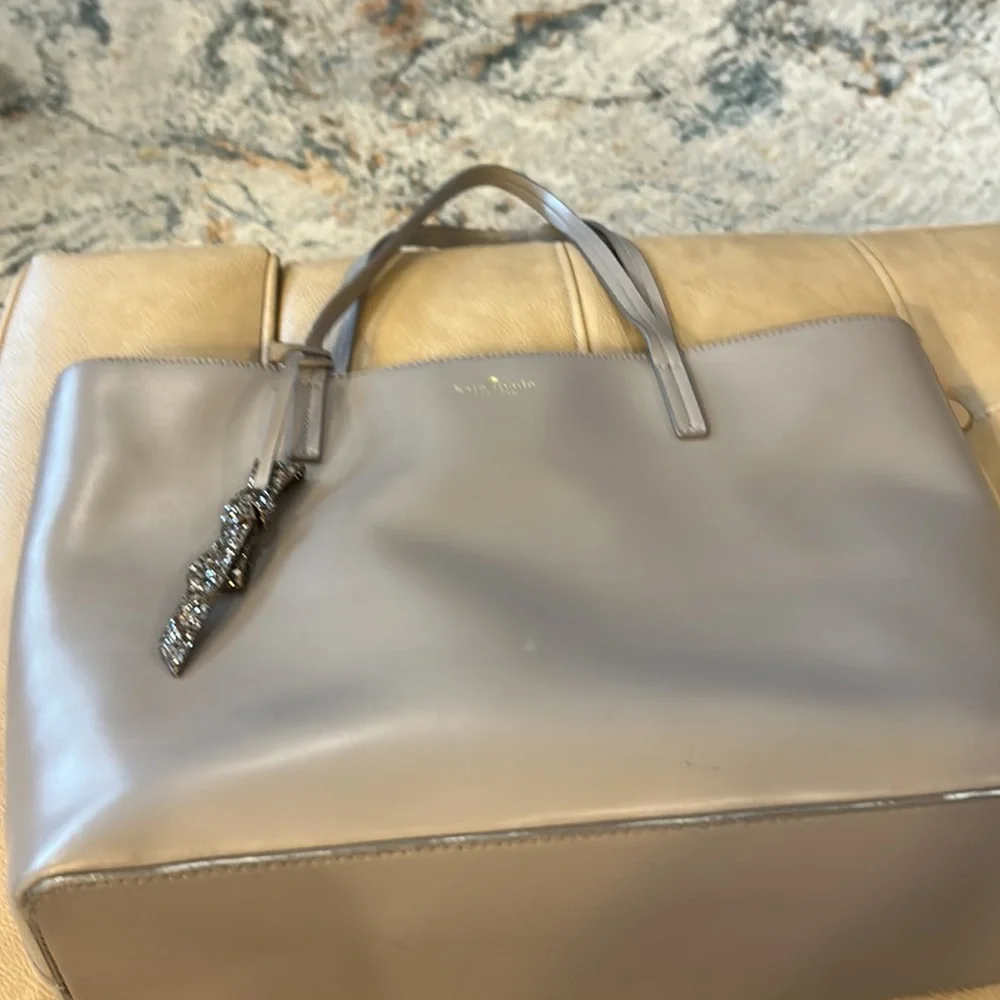 Kate spade large taupe tote with decorative gold glitter bow